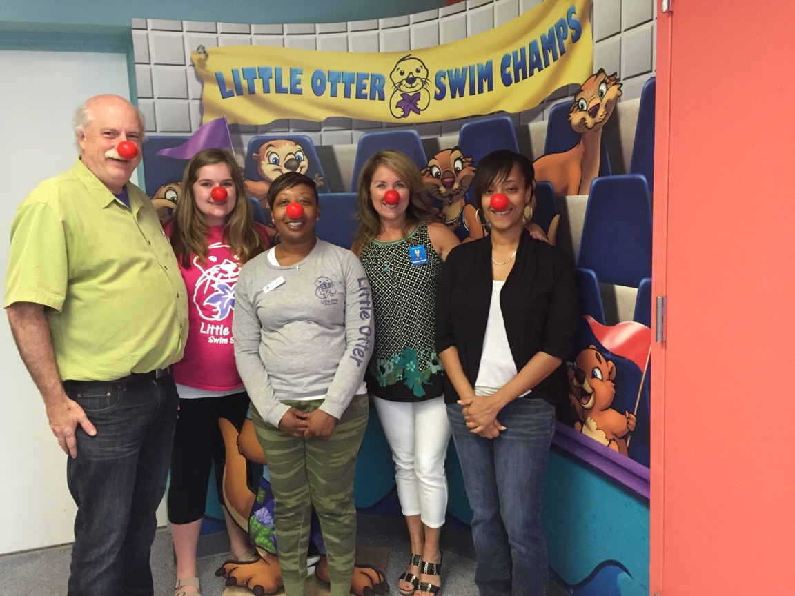 Jackrabbit members and Little Otter Swim Champs and wearing red noses for Red Nose Day.