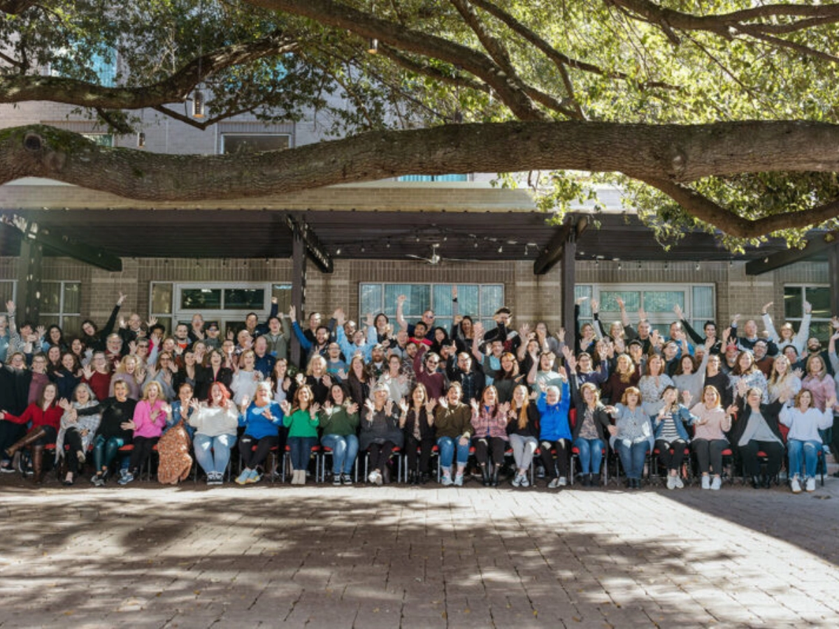 Jackrabbit Technologies members are jumping together at a corporate wellness event.