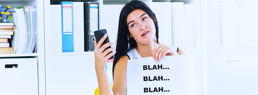 An annoyed woman talking on the phone.