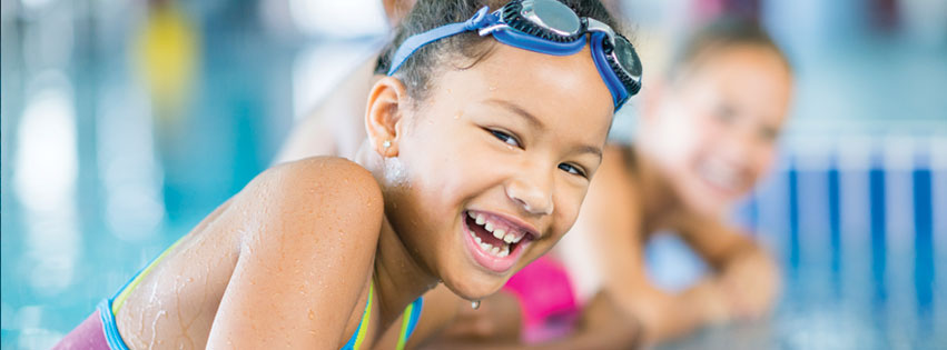 a happy, young female swimmer who has successfully got rid of swimmer's ear