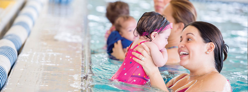 Mother and her toddler in a baby swim class