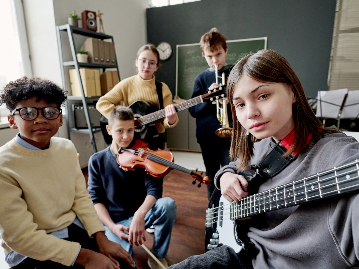 kids with instruments in class selfie