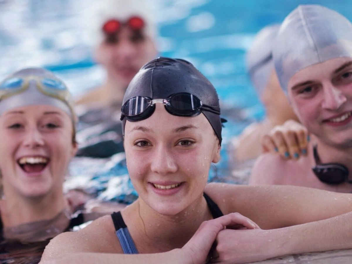 swim students smiling in the pool