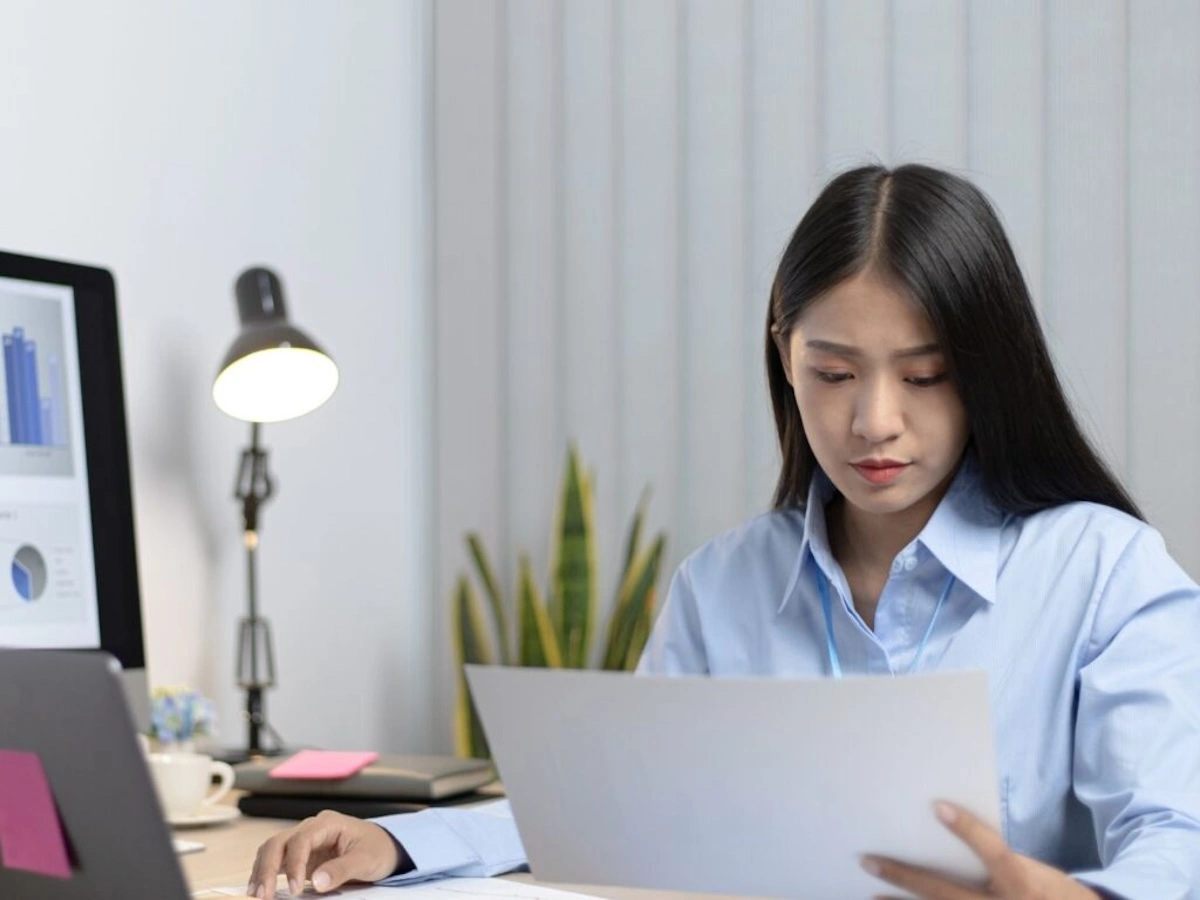 women looking at report on computer