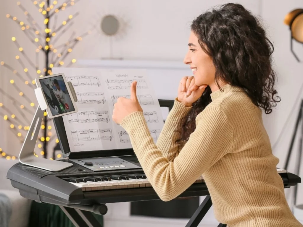 Music Teacher Instructs a Student During a Virtual Lesson