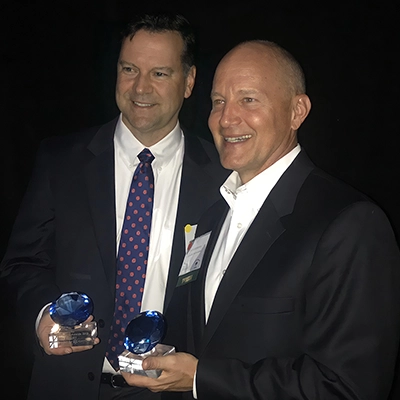 Mark and Mike accepting blue diamond award
